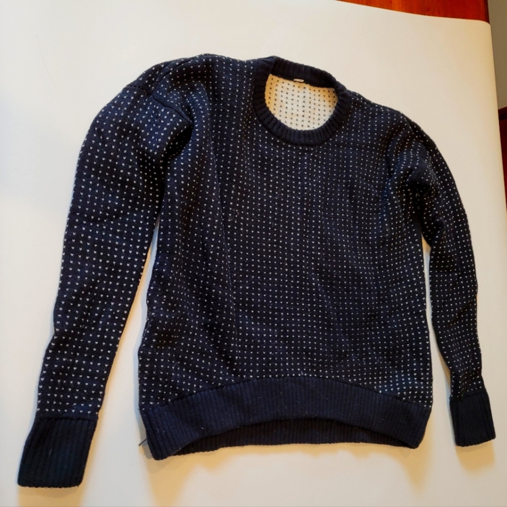 Black Lululemon wool sweater with side zippers.